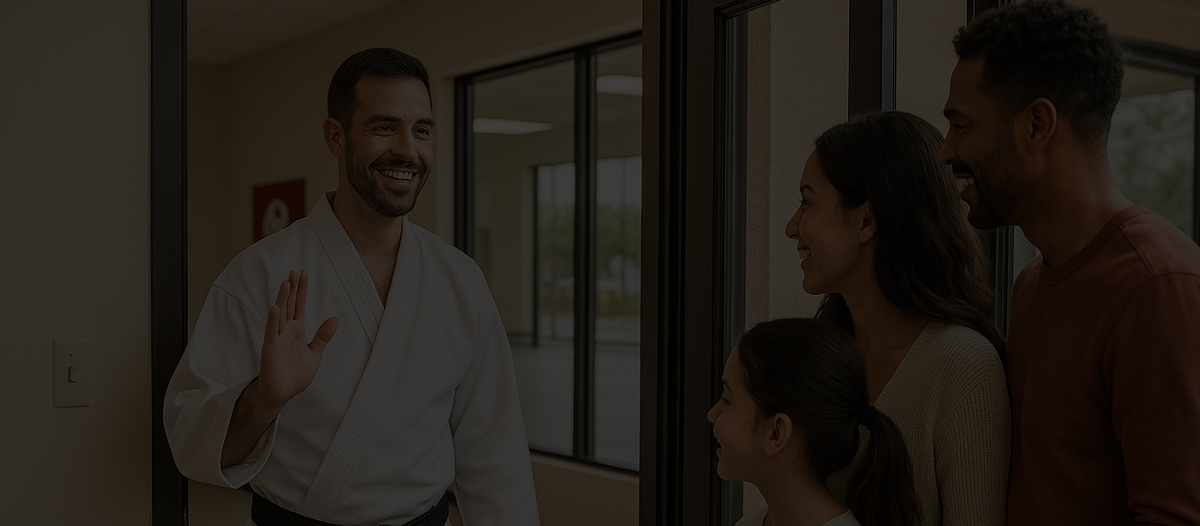 Martial Arts Instructor Greeting Family at Dojo - Studio Management Software